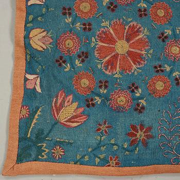 A CARRIAGE CUSHION, embroidered. "Blomsterdyna". 54 x 110 cm. Skåne (Scania, southern part of Sweden) around 1800.