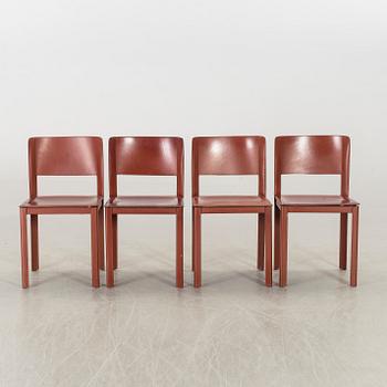 MATTEO GRASSI, a set of four leather chairs.