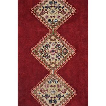 A Persian Rug, approximately 240 x 165 cm.