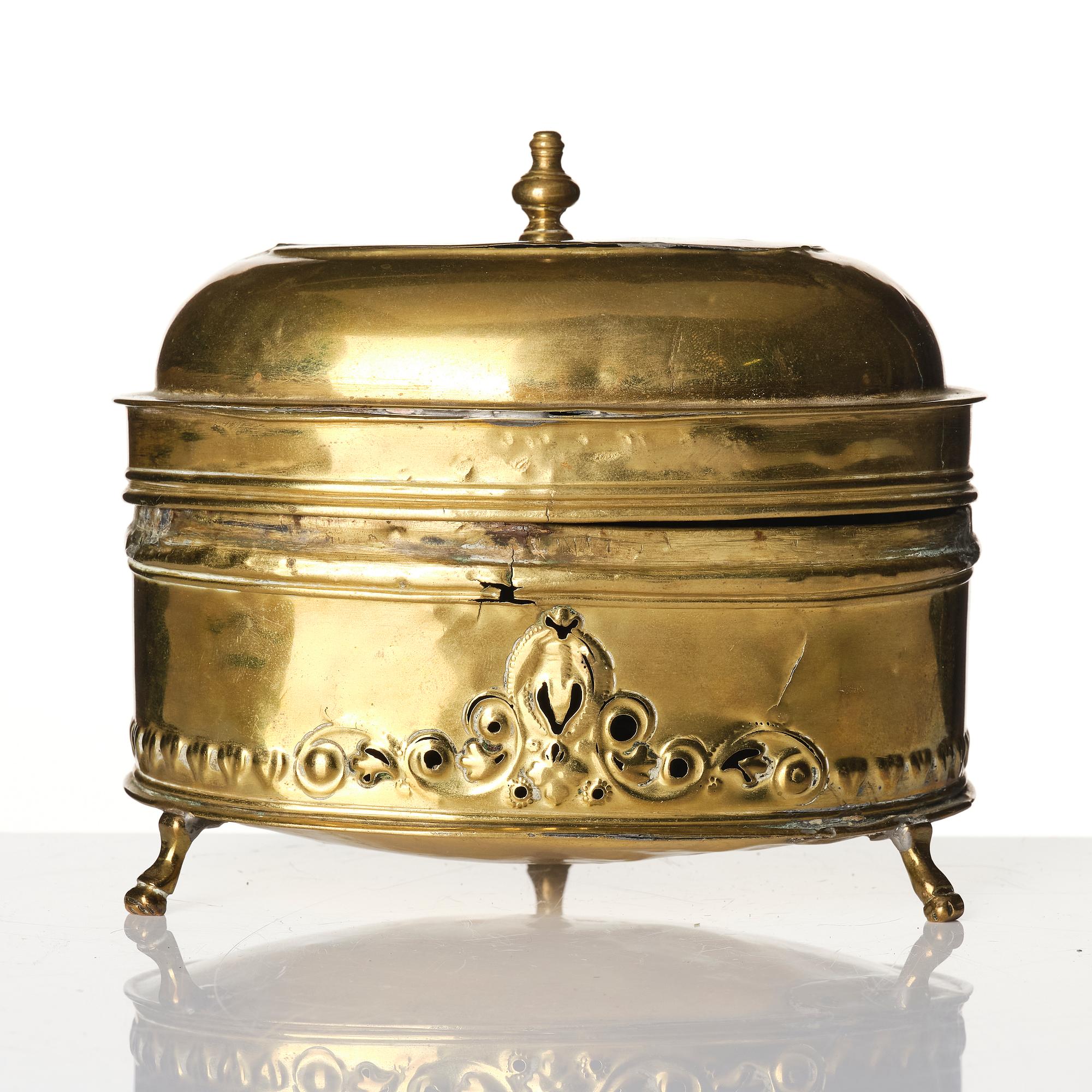 A baroque repousse brass pyxis, 18th century.