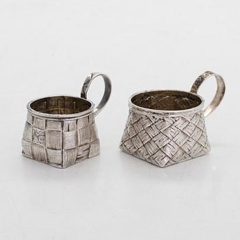 A silver and glass bottle with eight silver charka, maker marks of Pyotr Yermolajevich Davidov, Saint Petersburg, 1884.
