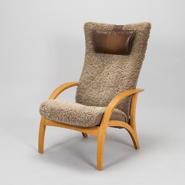 A 'Delta Adventure' armchair with ottoman, Brunstad, Norway.