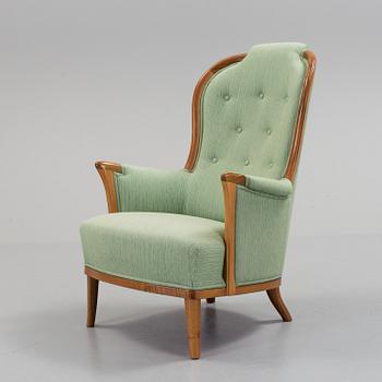 a Carl Malmsten "Vår Fru" armchair from the second half of the 20th century.