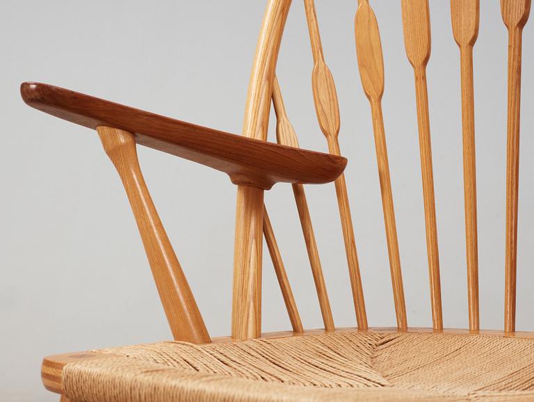 A Hans J Wegner ash and teak 'Peacock chair', Johannes Hansen, Denmark.