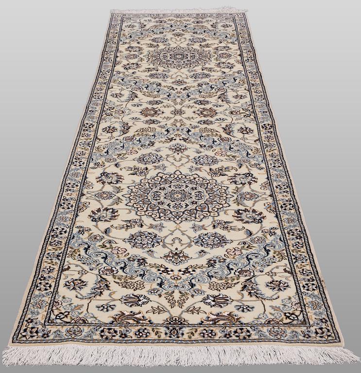 A Nain part silk runner carpet, 311 x 88 cm.