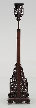 A hardwood lantern stand, with carved stylized dragons, presumably late Qing dynasty.