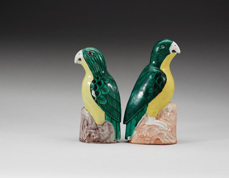 A set of two green and yellow glazed parrots, Qing dynasty, Jiaqing (1796-1820).