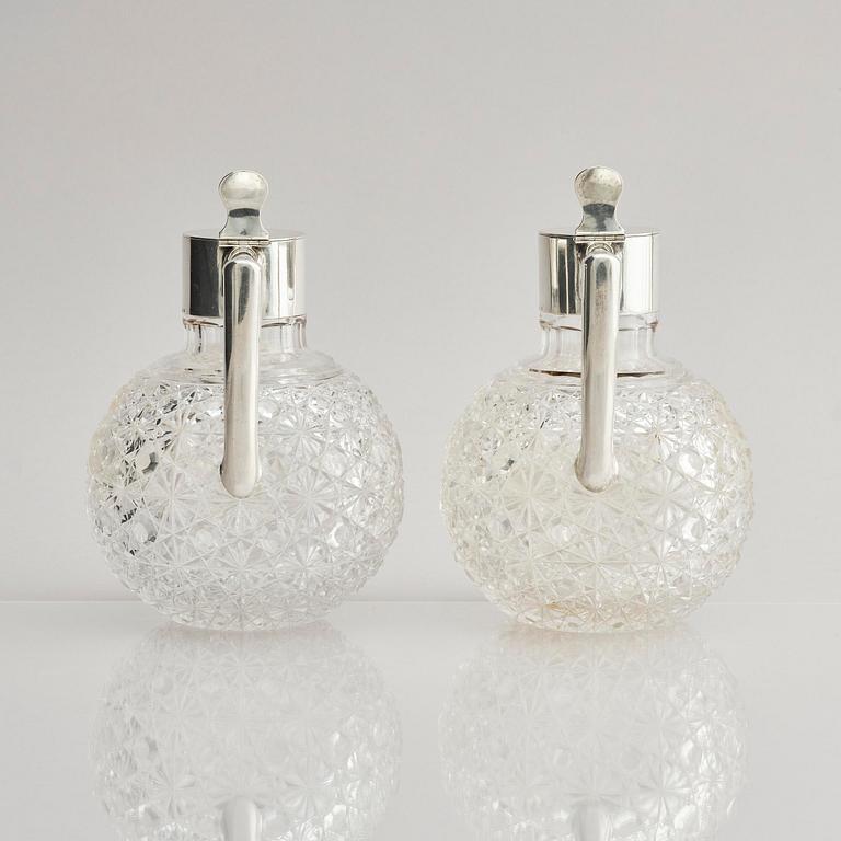 A Swedish pair of silver and cut-glass decanters, mark of C.G. Hallberg, Stockholm 1893.