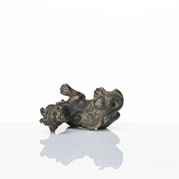 A bronze figure of a reclining beast, late Ming dynasty/early Qing dynasty.