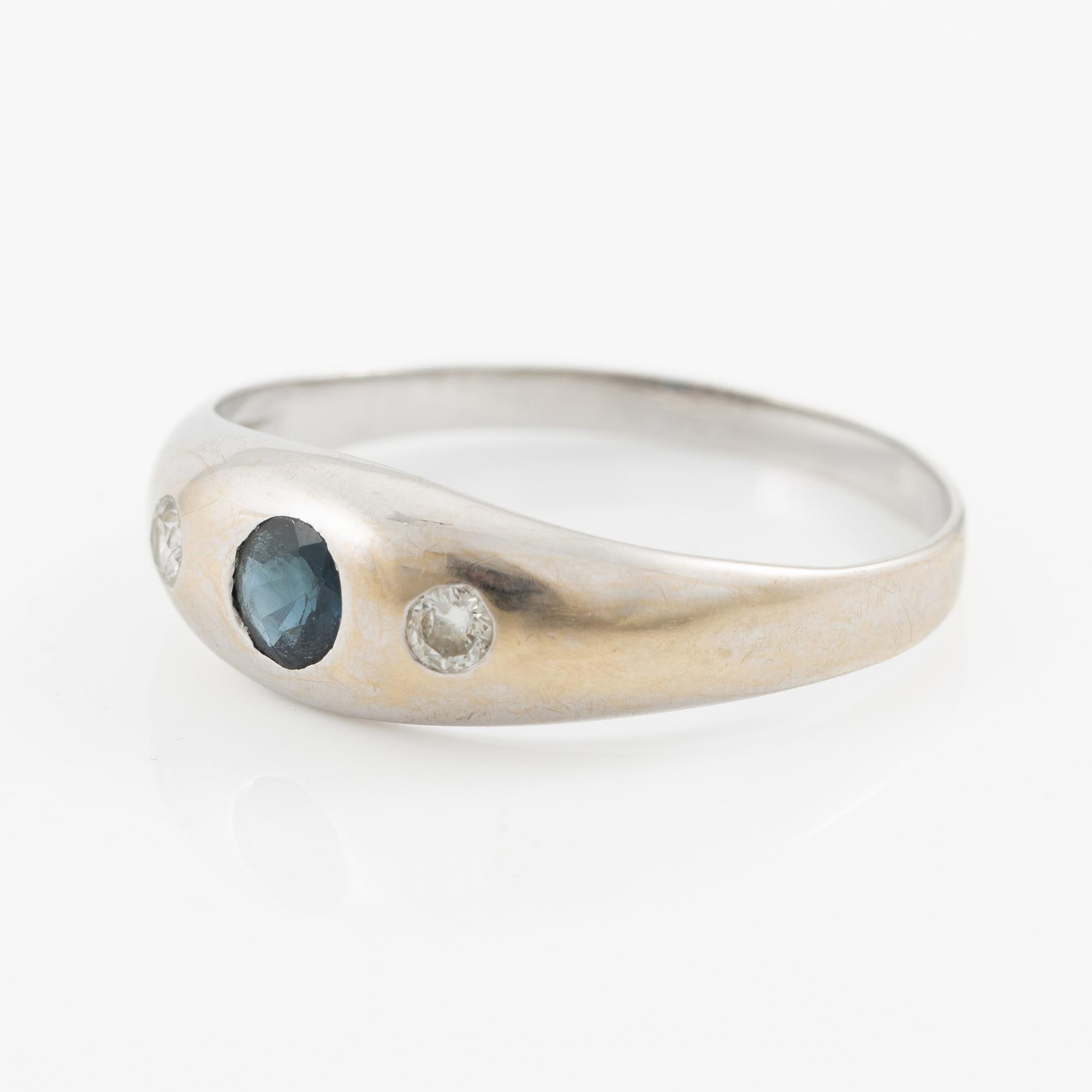 Ring, 18K white gold with sapphire and brilliant-cut diamonds.