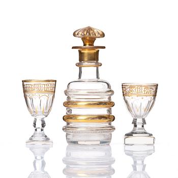 A set of Russian glasses (13 pcs.) and a bottle with stopper, 19th Century.