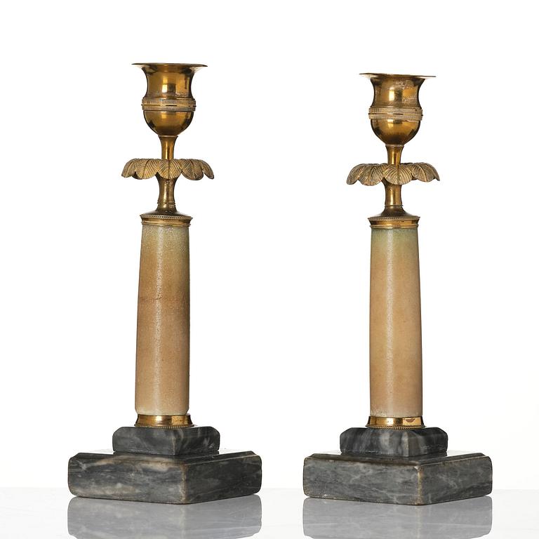 A pair of late Gustavian gilt brass and marble candlesticks, Stockholm, late 18th century.