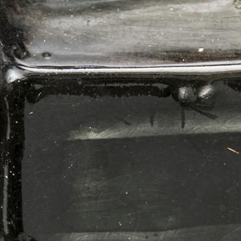 A stoneware tray table signed Bryk.