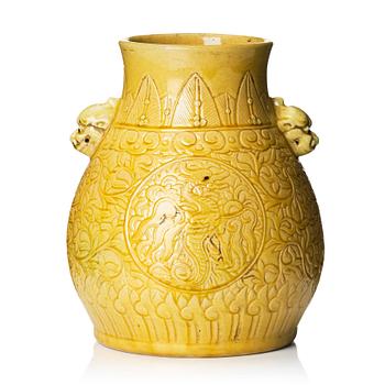 A yellow glazed phoenix vase,  Qing dynasty, with a Kangxi mark.