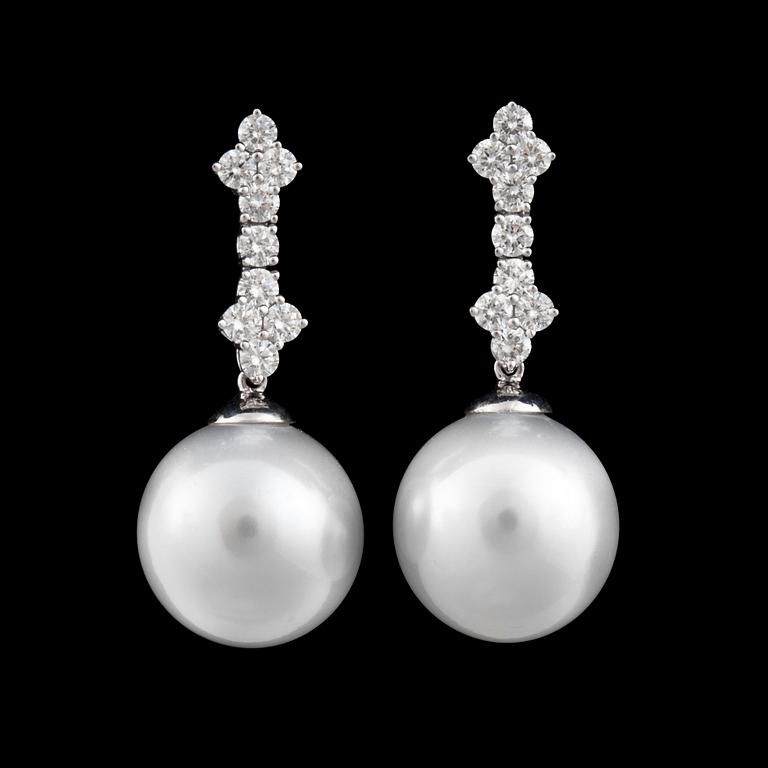 A pair of cultured South sea pearl and diamond earrings. Ø 14.7 - 15 mm. Total carat weight of diamonds circa 1.34 cts.