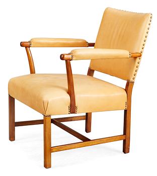 A Josef Frank mahogany and beige leather armchair, Svenskt Tenn.