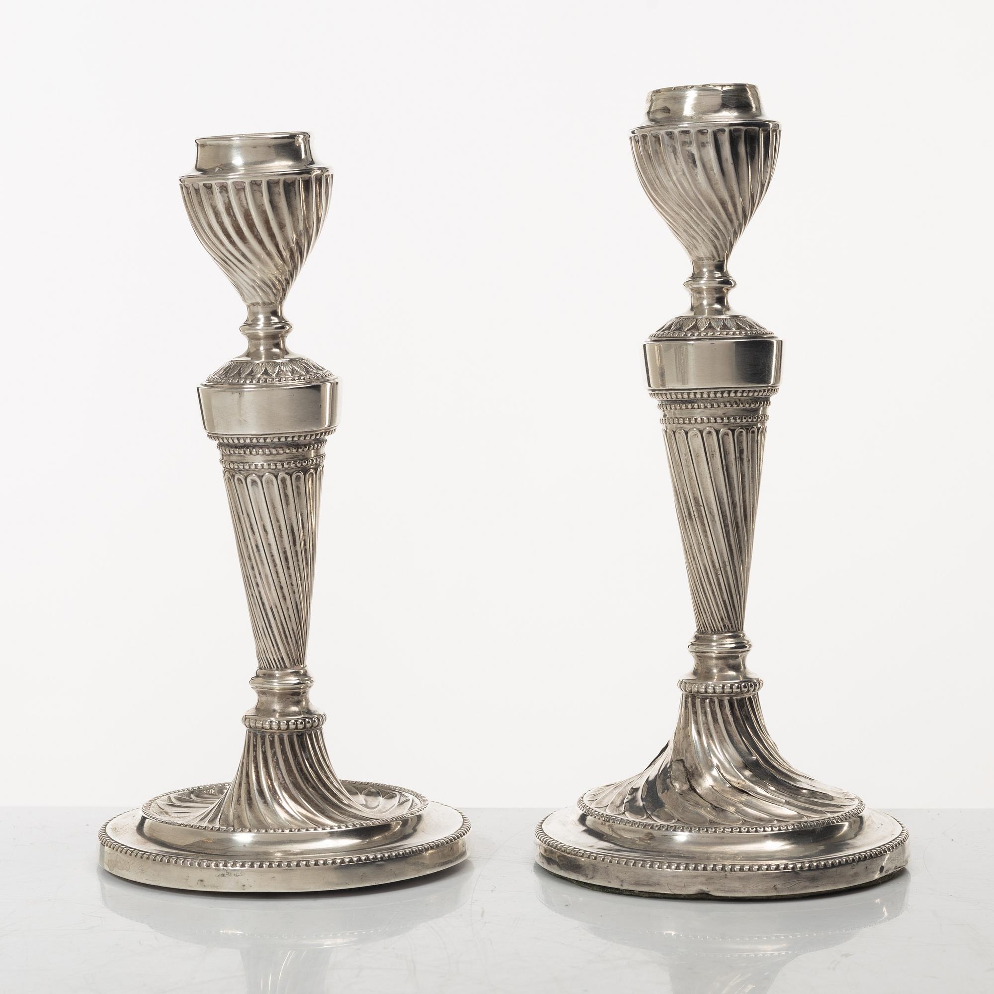 A pair of English silver candelabra, mark of Hawksworth, Eyre & Co Ltd, Sheffield 1892.