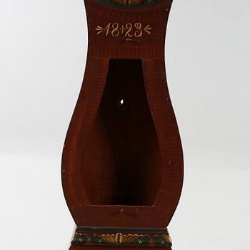 A grandfather clock dated 1823.