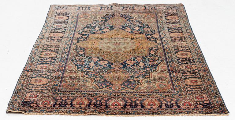 An antique Kashan 'Mohtasham' rug, c. 206 x 131 cm.