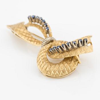 Brooch, 18K gold in the shape of a bow with sapphires, Italy.