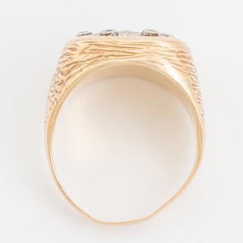 An 18K gold ring set with eight-cut diamonds.