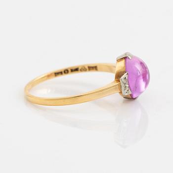 18K gold and cabochon cut syntehtic pink sapphire.