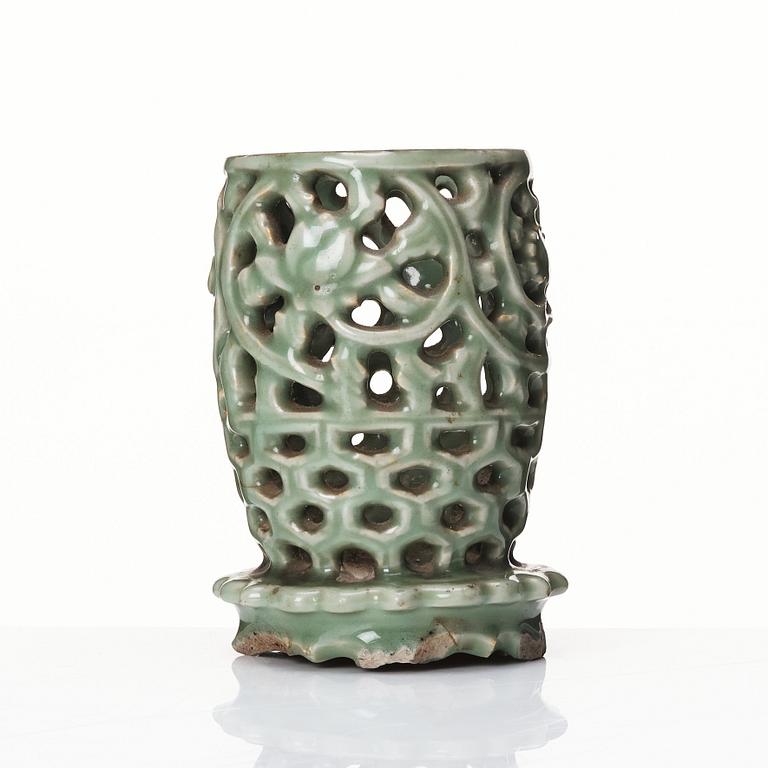 A reticulated lonquan celadon vase/candle holder, Ming dynasty (1368-1644).