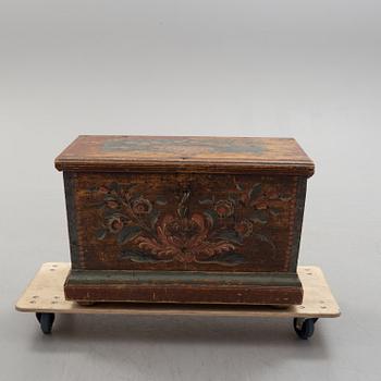 A painted pine chest from Bjuråker, Hälsingland, dated 1828.