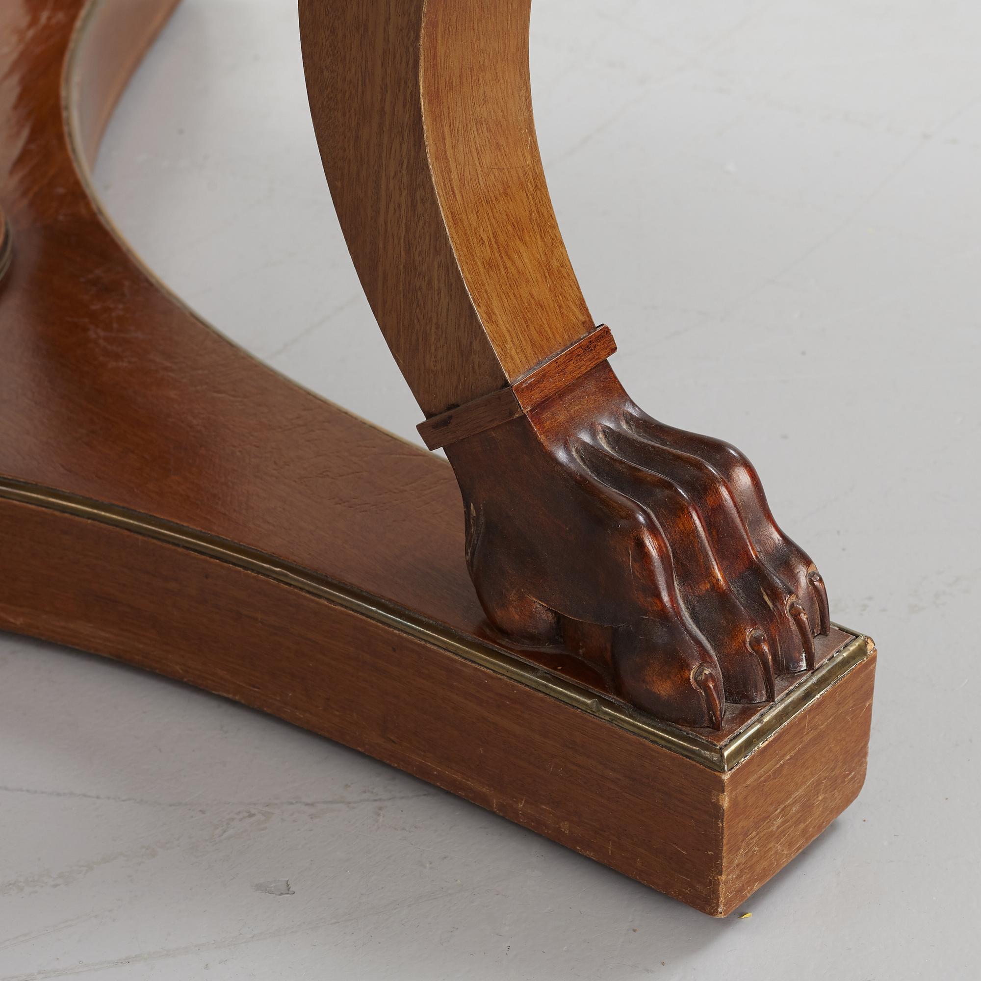 A mahogany veneered Empire style table, first half the 20th Century.
