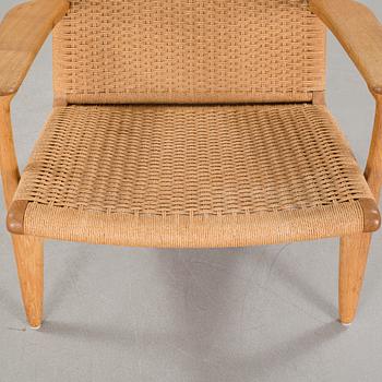 A lounge chair by Hans J Wegner, model "CH-25", for Carl Hansen & Son, Denmark, second half of the 20th century.