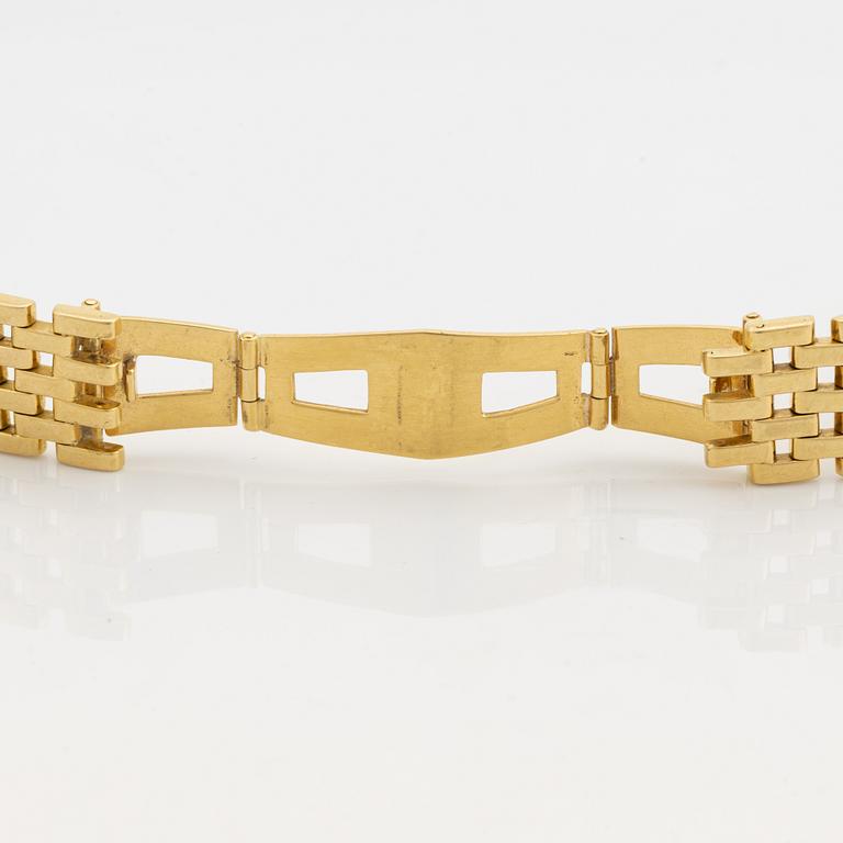 An 18K gold watch bracelet.