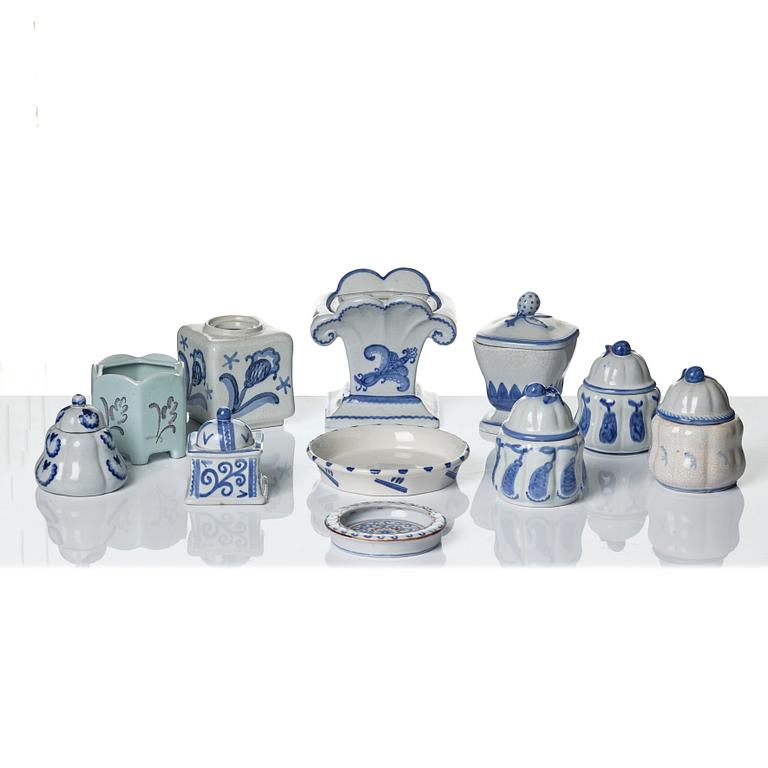 Wilhelm Kåge, eleven pieces of faience including jars, inkwells and a tulip vase, Gustavsberg, Sweden, 1919-1920.