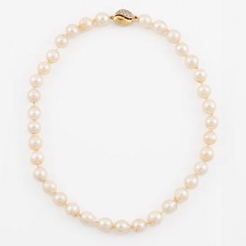 Necklace with cultured pearls, clasp 18K gold set with octagon-cut diamonds.