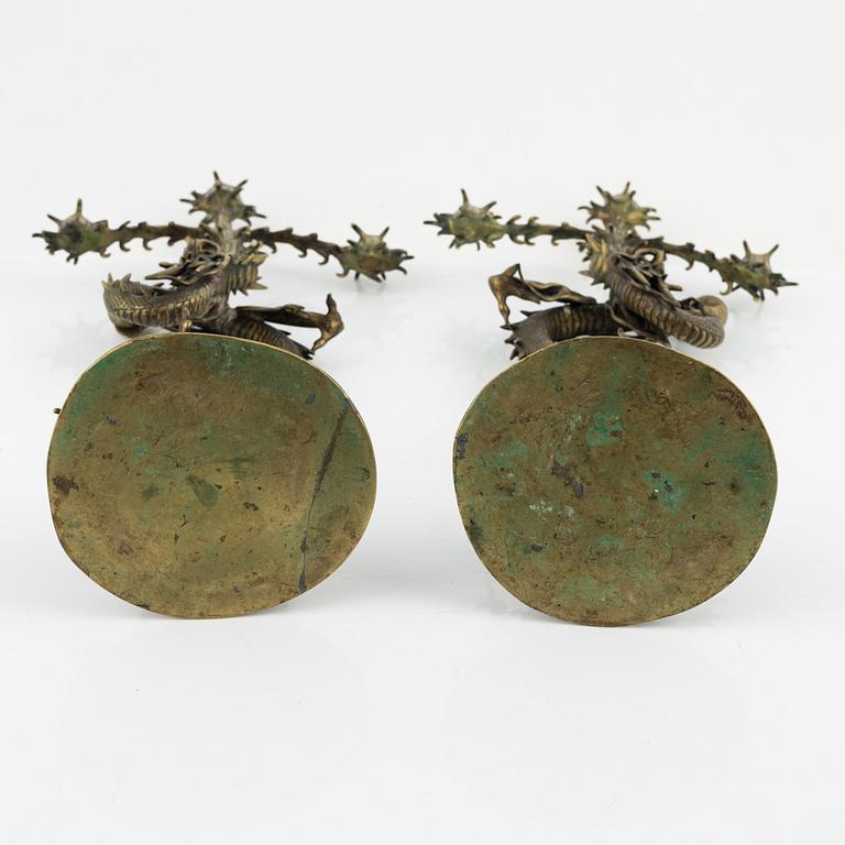 A pair of brass candelabra, Japan, early 20th century.