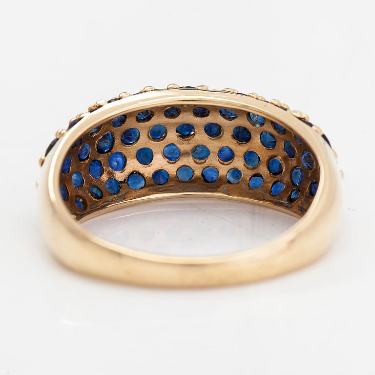 A 14K gold ring with sapphires.