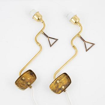 A pair of brass wall lights,  second half of the 20th century.