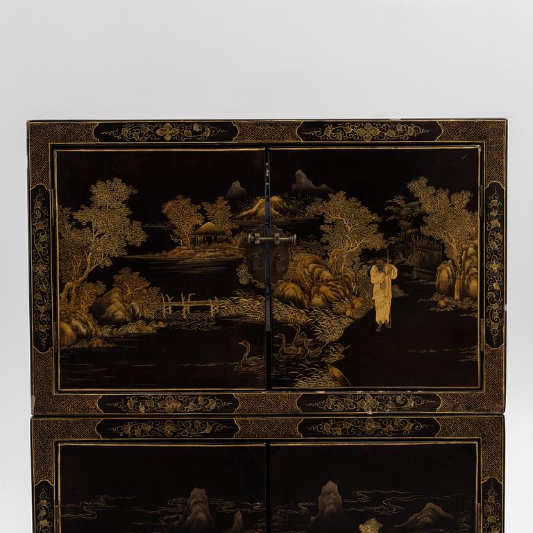 A Chinese lacquered two-part cabinet, first part of the 20th century.