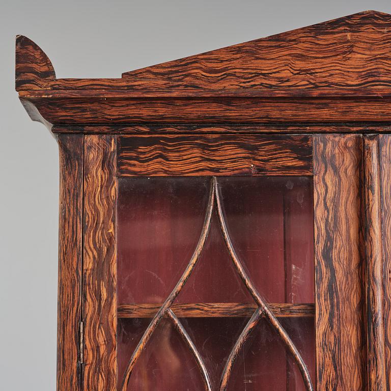 A Swedish faux-boix neo-gothic book cabinet, ca 1830.