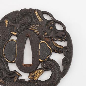 Five iron tsubas with dragon motives, probably 19th Century.