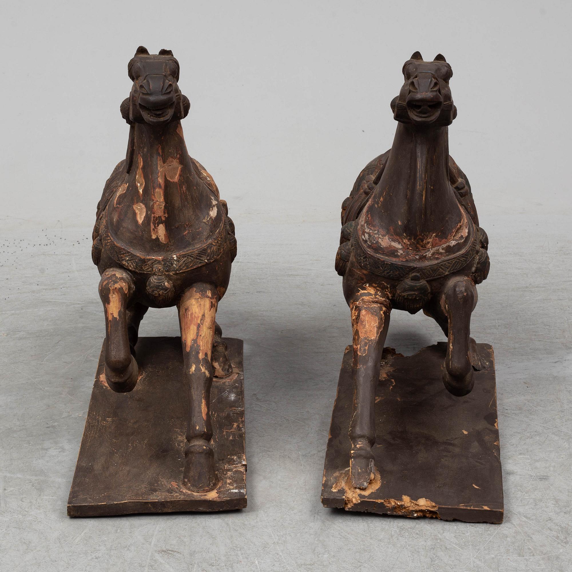 Two large wooden sculptures of horses, 20th century.