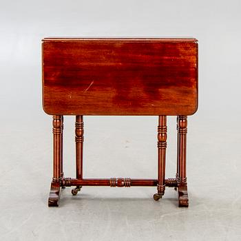 A 20th century English mahogany folding table.