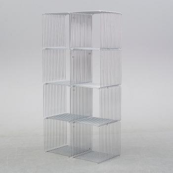 A 'Panton wire' shelving system by Verner Panton for Montana.