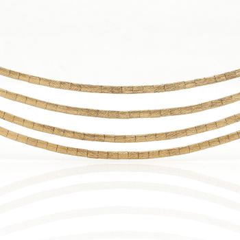 HALSBAND samt ARMBAND, 18K guld troligen med små safirer och rubiner. Total vikt ca 71 g.