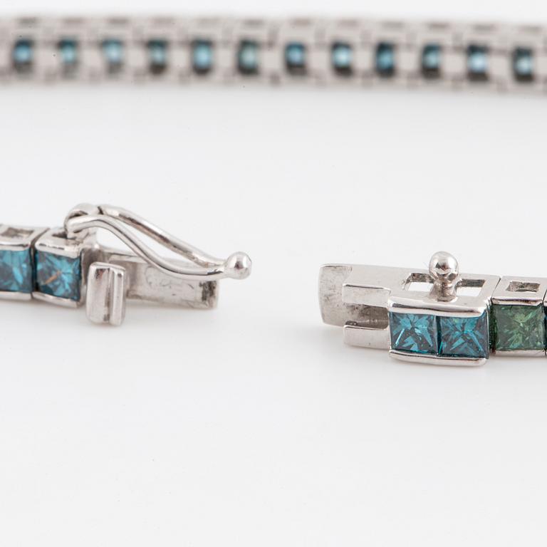 A bluegreen princess-cut diamond bracelet.