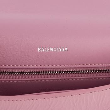 Balenciaga, a pink leather 'Downtown' bag.