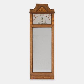 An Empire style mahogany-veneered mirror, around 1900.