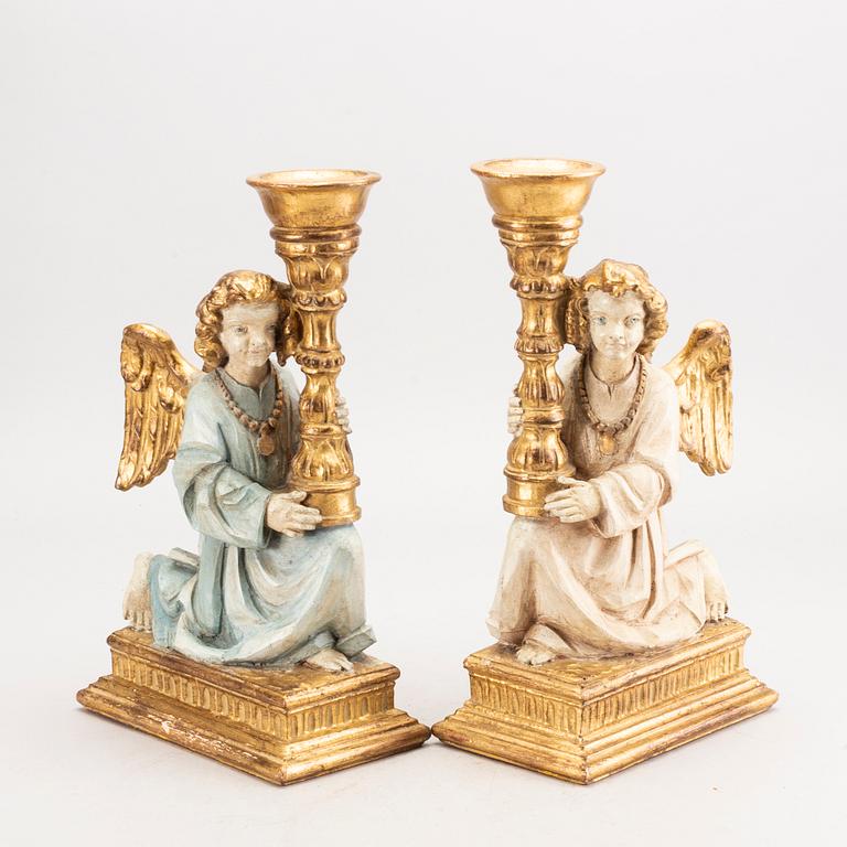 A pair of mid 20th century wood candle sticks from Paoletti, Firenze Italy.