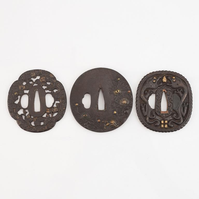 Seven tsuba of different origin, 18th - 20th Century.