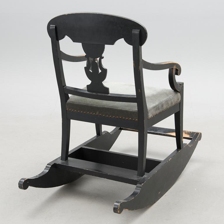 An empire style rocking chair from the end of the 19th Century.