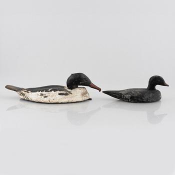 A set of six wooden duck decoys, 20th century.